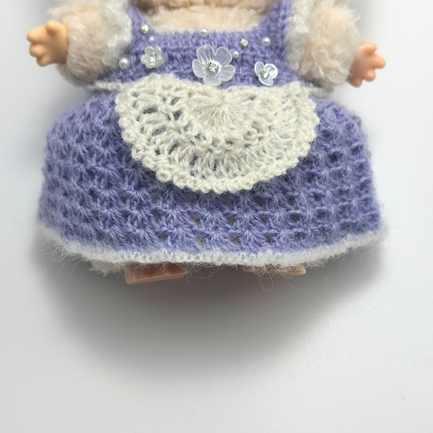 labubu doll with a purple and white dress on a white background