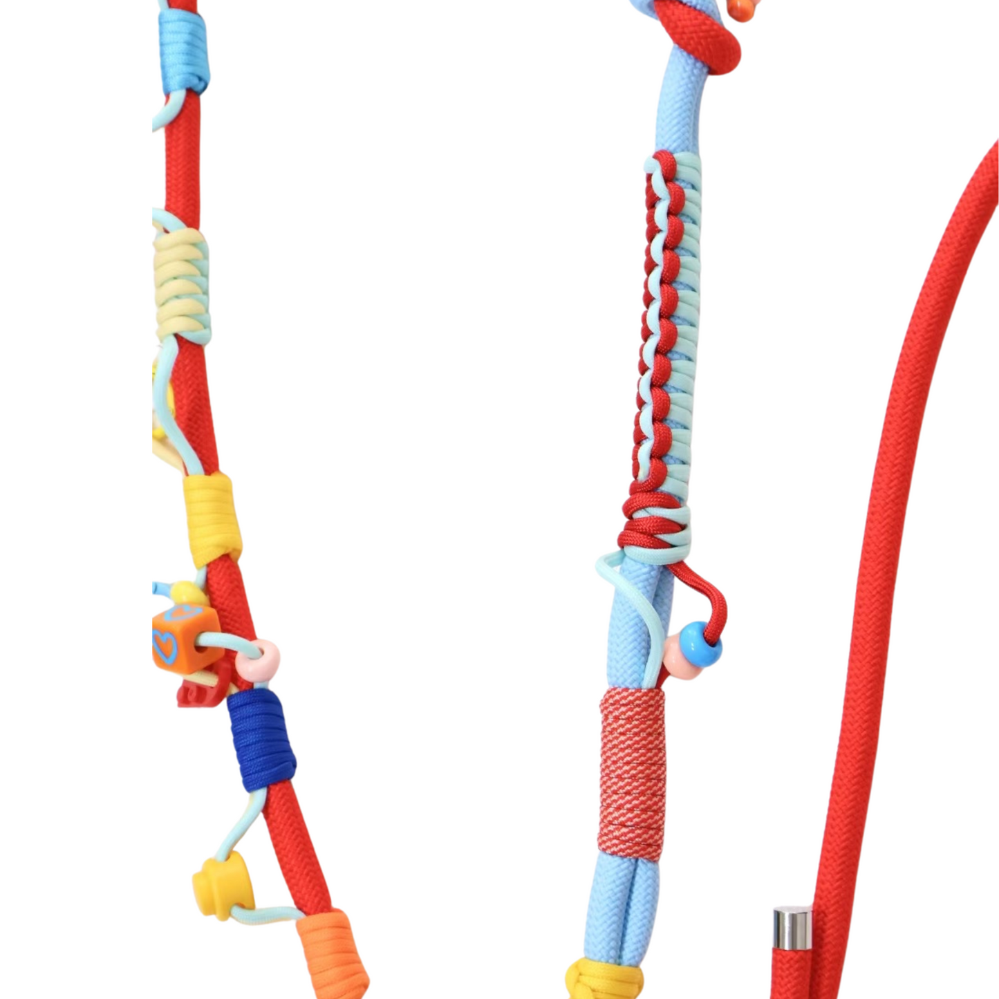 Close-up detail of multifunctional colorful crossbody pet leash showing rope construction, decorative wrapping and small charms