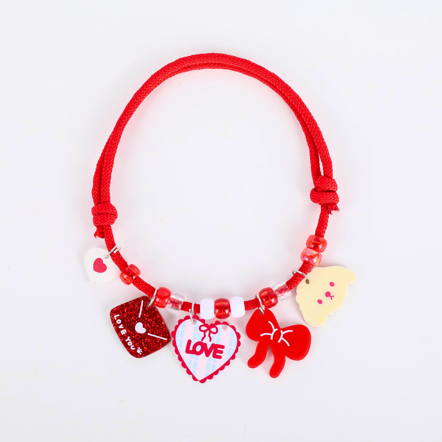 pet collar with colorful charms on a white background