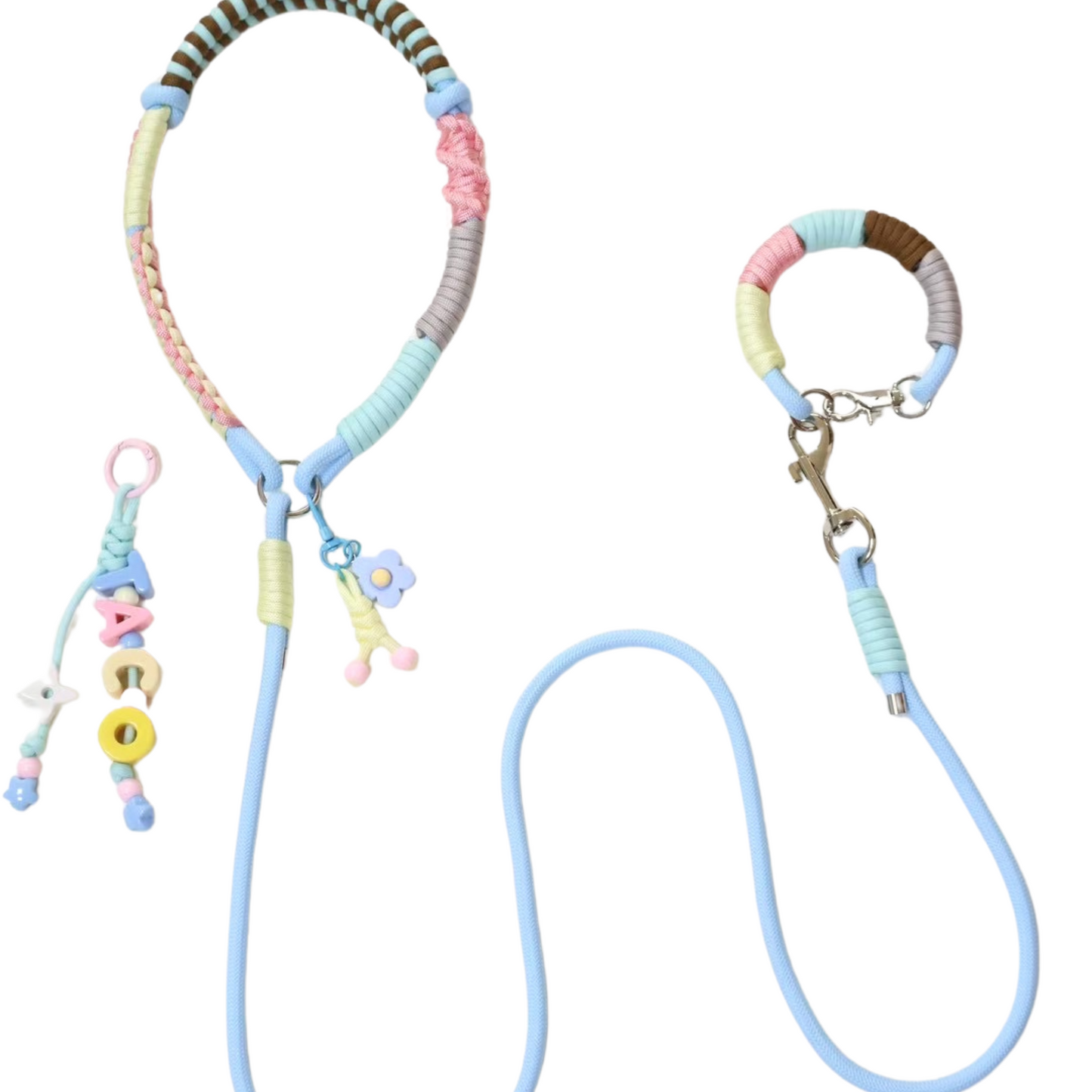 Handmade pastel wrapped rope dog leash set featuring multicolor collar with flower charm, matching wrist strap with key charm, letter beads accessory, and blue rope leash
