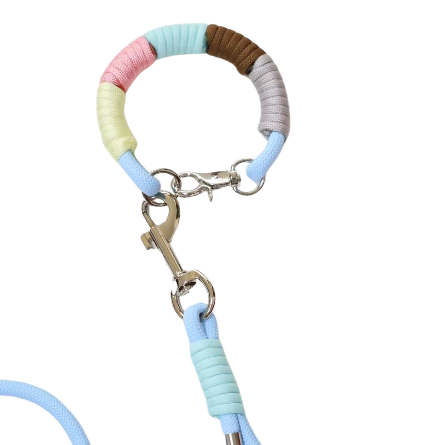 Close-up detail of handmade pastel dog leash with collar showing multicolor wrapped rope sections with metal clasp and key charm attachment, featuring pink, mint, brown, yellow, gray, and blue segments
