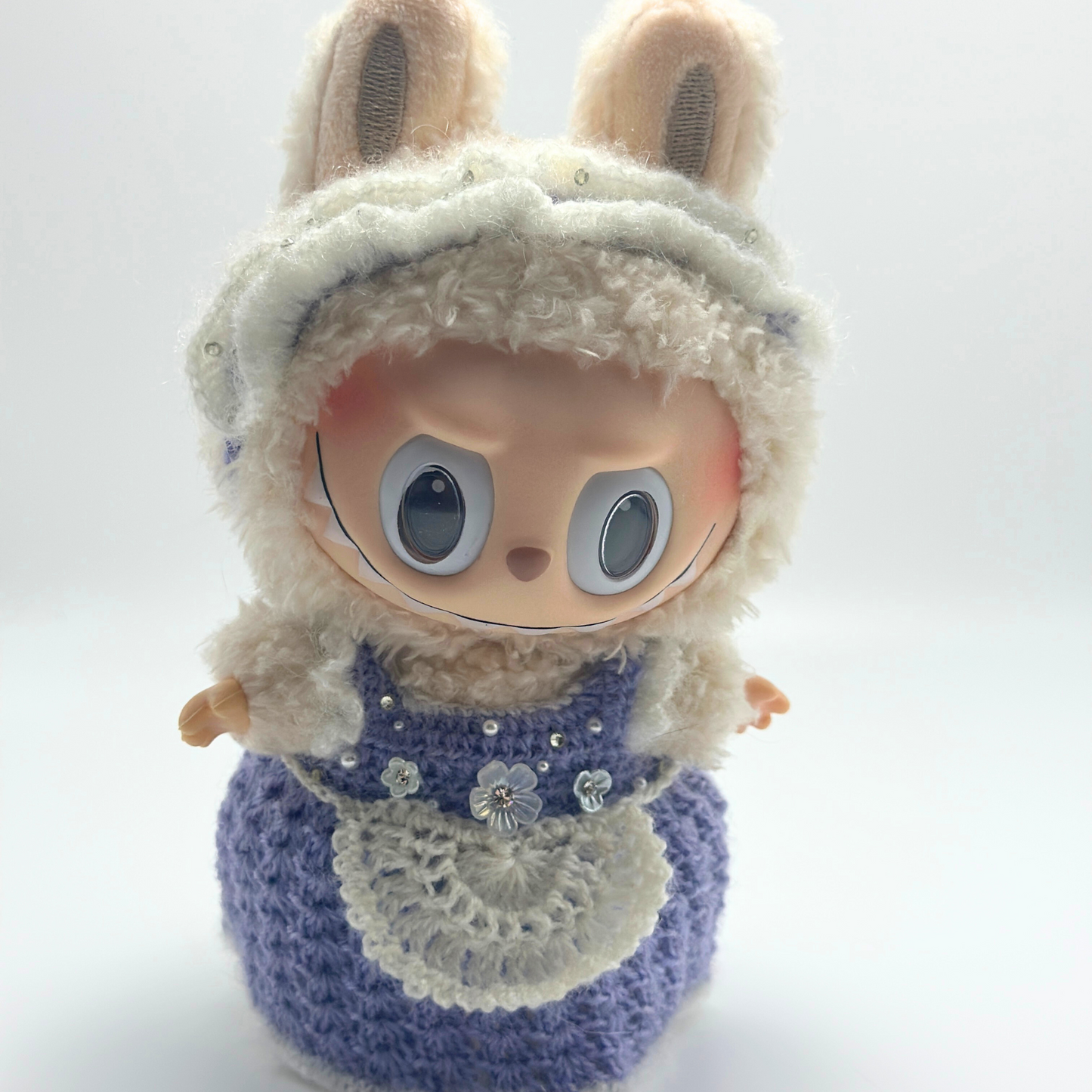 labubu with blue dress on a white background