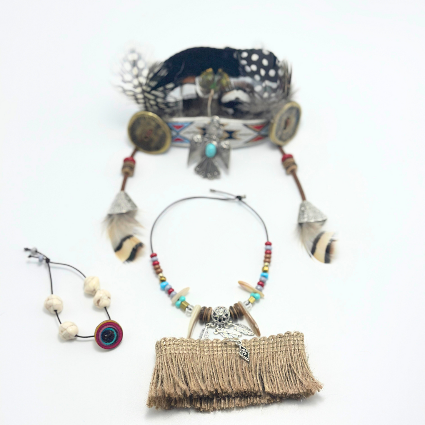 Complete Labubu tribal warrior costume set showing separated accessories - feather headdress, turquoise beaded jewelry, fringed skirt and decorative charms in detailed flat lay arrangement