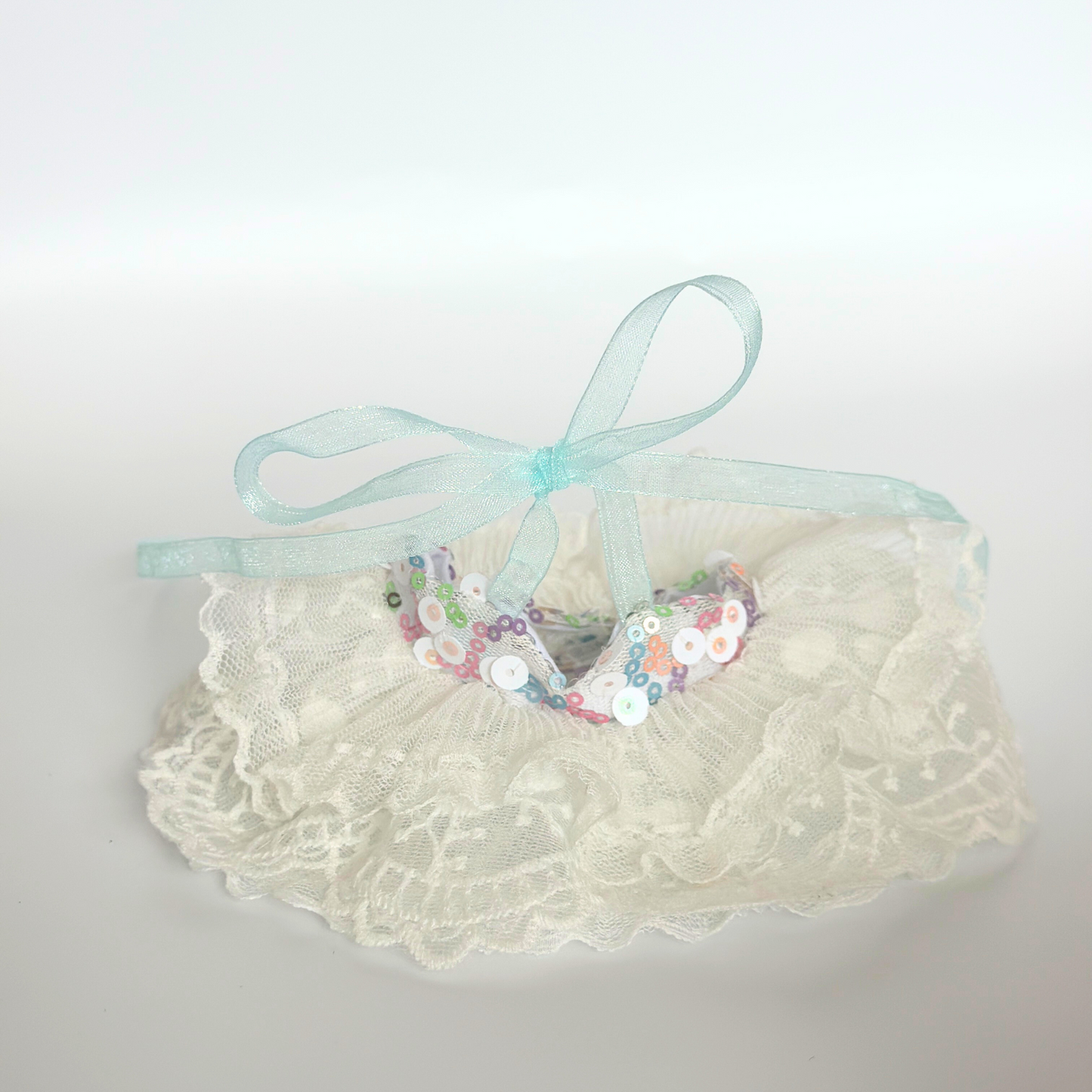 White lace tutu skirt for Labubu doll with colorful sequin bow decoration and mint green ribbon tie, doll costume accessory