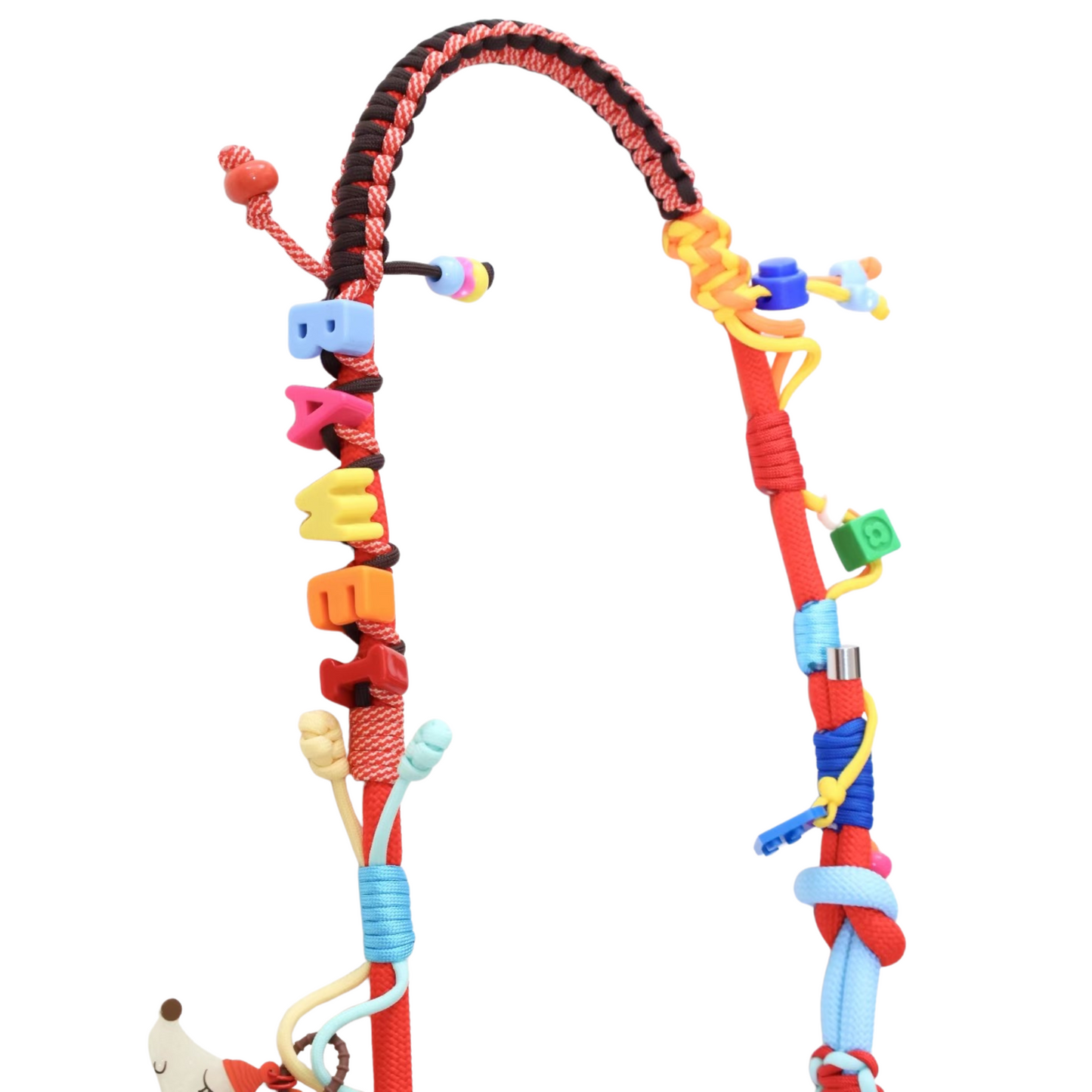 Close-up detail of multifunctional colorful crossbody pet leash with letter name beads, charms and decorative rope wrapping