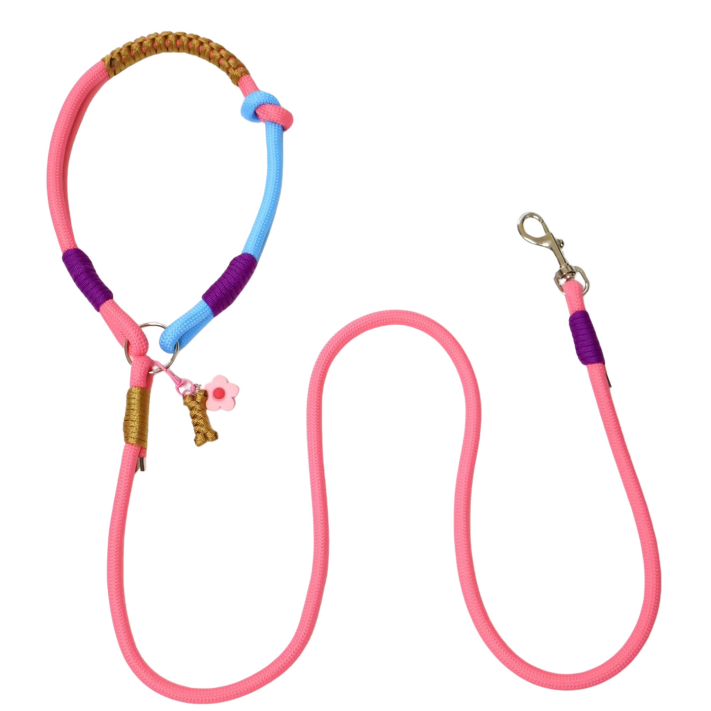 Pink slip lead dog leash with colorful rope handle featuring pink, purple, blue and brown paracord weaving, flower charm and bone charm attachments