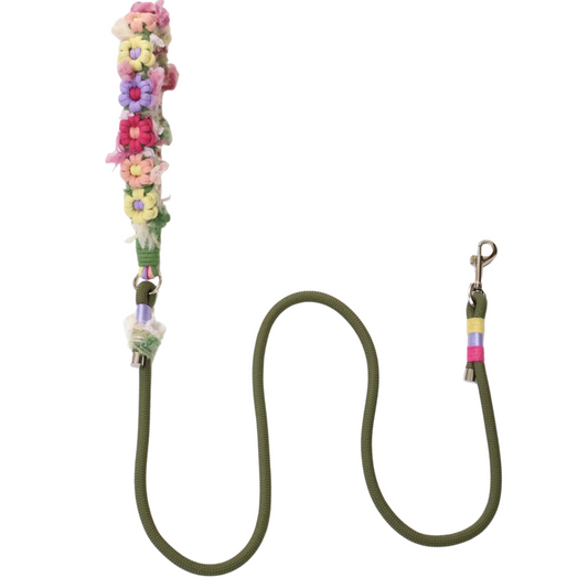 Olive green dog leash with colorful floral decorative sleeve featuring pink, blue, yellow and purple flowers with metal clasp