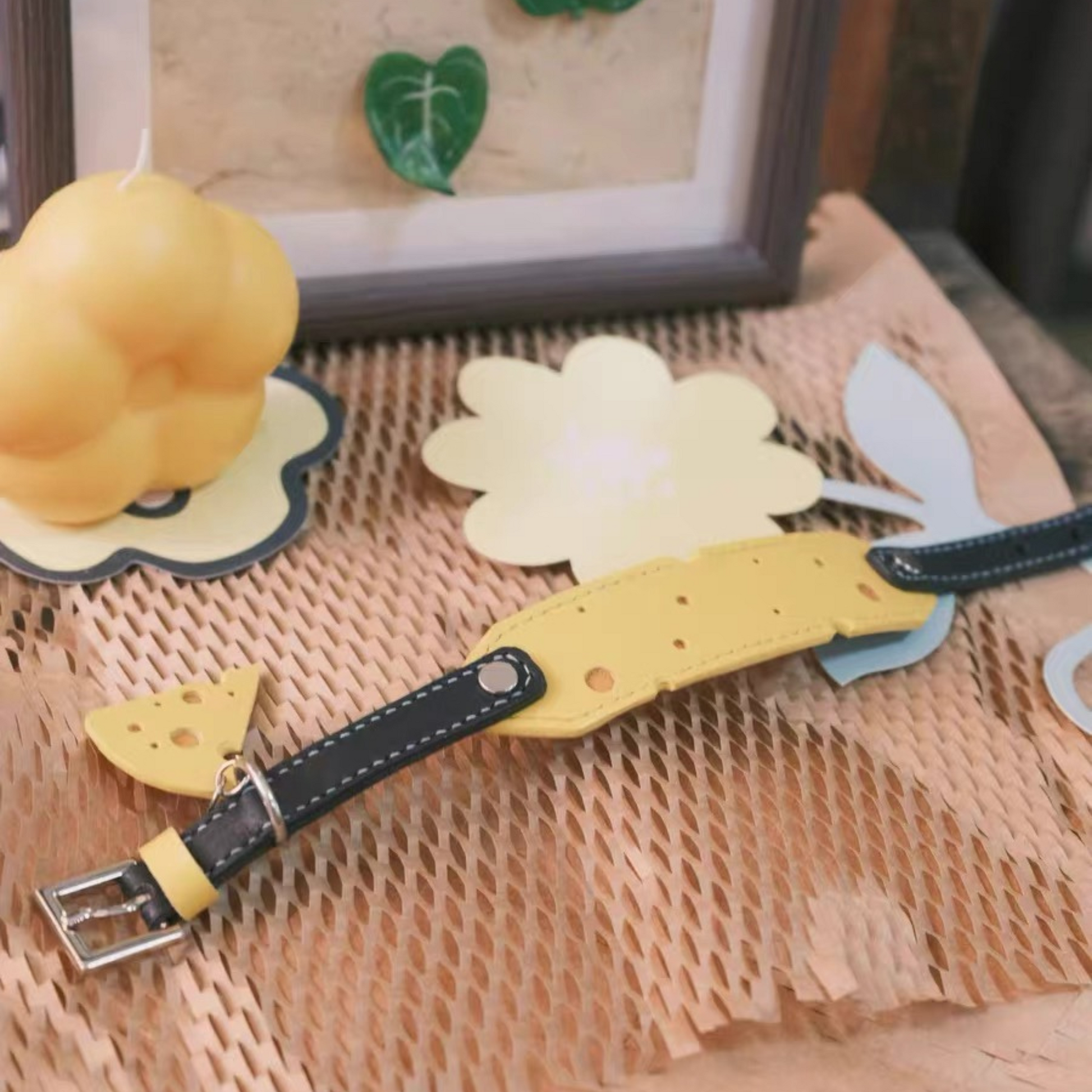Premium cheese-shaped pet collar in yellow leather with black details - unique dog collar with decorative lifestyle photography