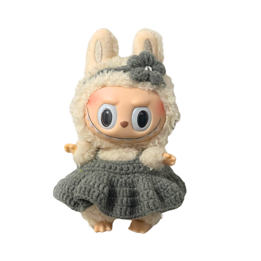 Cute Labbubu character doll dressed in grey crochet outfit with decorative flower