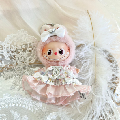 Labubu 4.0 doll wearing a pink Chanel-inspired outfit with fluffy hood, white bow, and layered ruffle dress, elegant kawaii collectible doll clothes