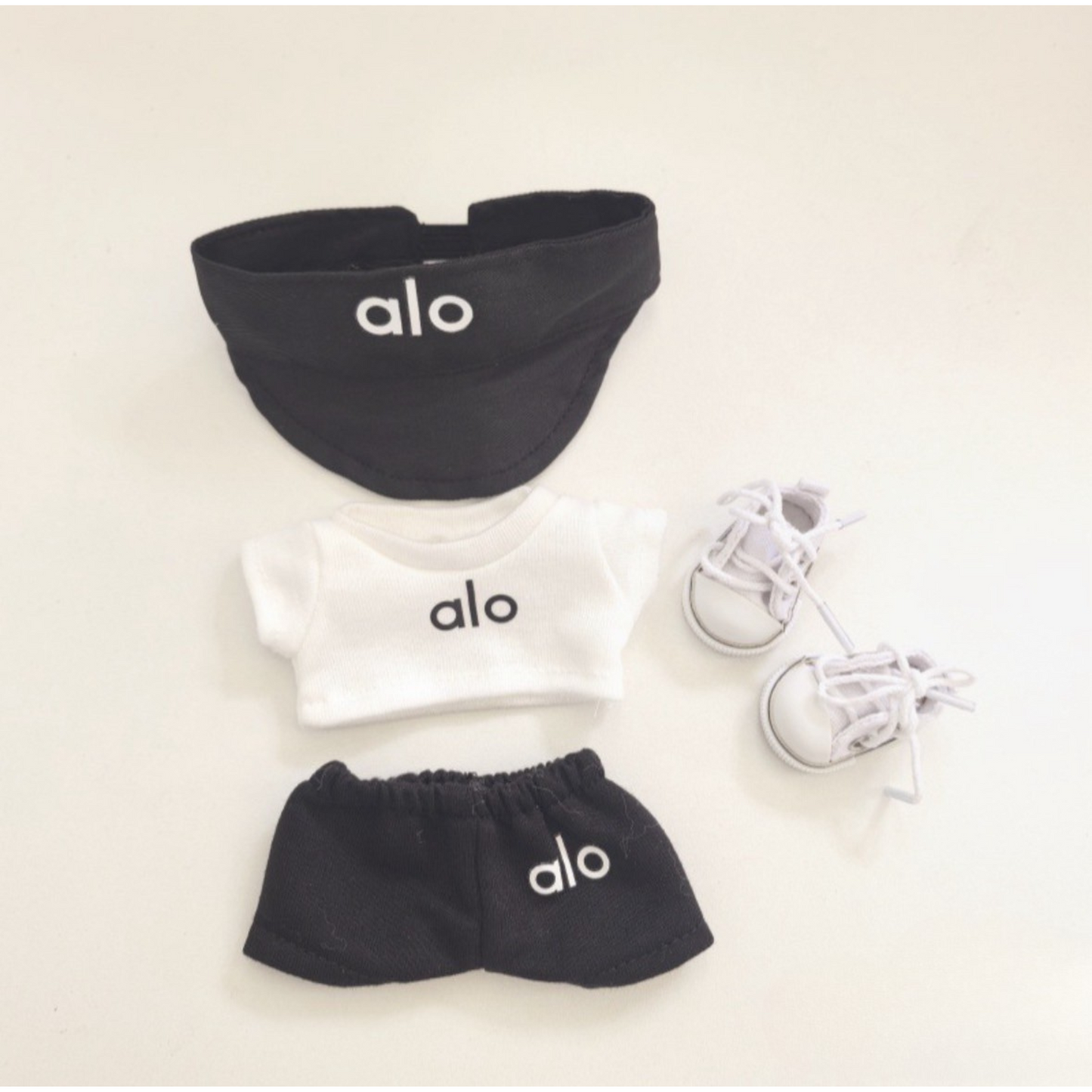 Complete alo branded labubu outfit set with black bucket hat, white hoodie, black shorts and white sneakers