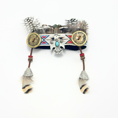 Decorative headband with feathers and tribal patterns on a white background