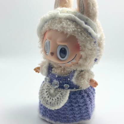 labubu with a blue dress and white hood on a white background
