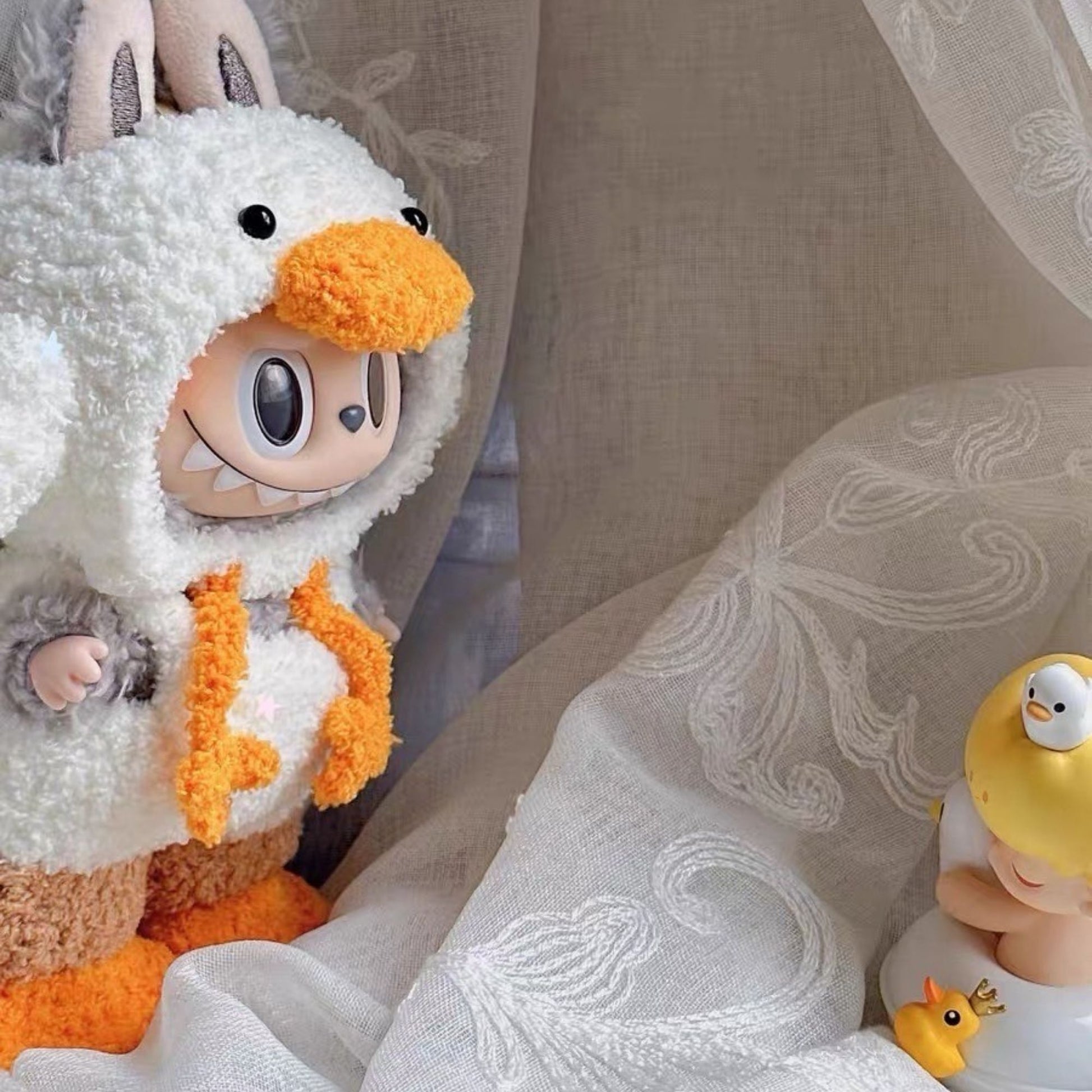 Adorable Labubu doll dressed in dopamine-style duck hoodie outfit, handmade doll clothes