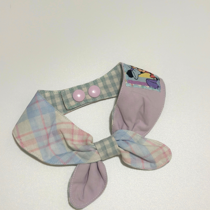 Pastel plaid dog collar with a bow on a white background