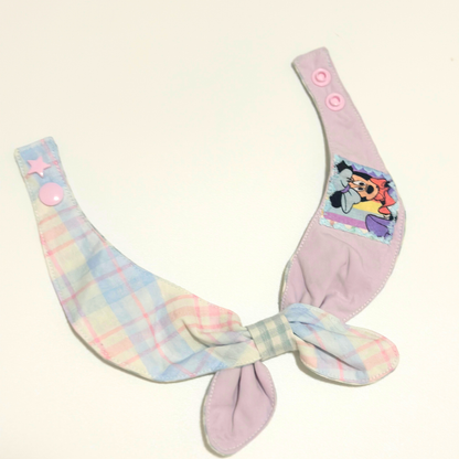 Pastel-colored pet bib with cartoon character on a white background