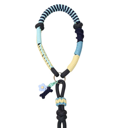 Detailed view of custom pet leash ergonomic handle with multi-colored rope wrapping, decorative charm attachments including blue flower, and reinforced knotted construction