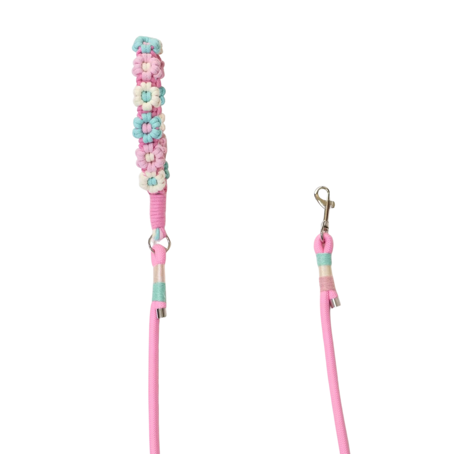 A pink dog leash with handle decorated in multicolored artificial flowers in pastel shades of mint green, pink, white, and cream, featuring metal clips and colorful rope wrapping